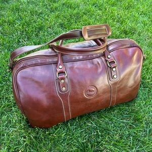 Elegant Brown Leather Duffel Bag with Brass Hardware